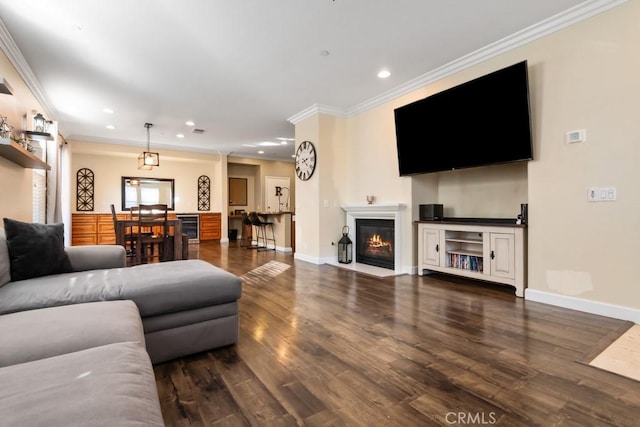 living room featuring crown molding, beverage cooler, and dark hardwood / wood-style floors