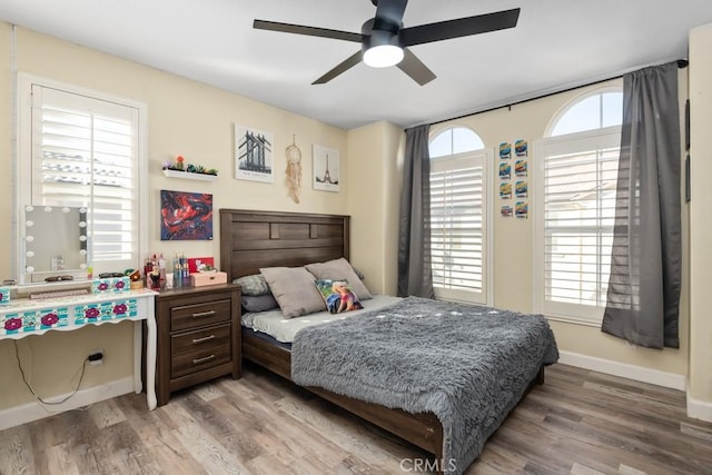 bedroom featuring hardwood / wood-style floors and ceiling fan