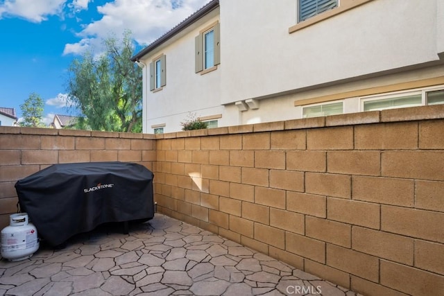 view of patio featuring a grill