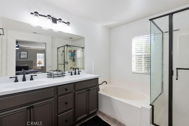 bathroom with vanity, ceiling fan, and separate shower and tub