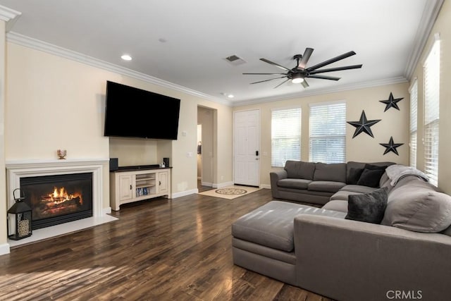 living room with crown molding, ceiling fan, and dark hardwood / wood-style flooring