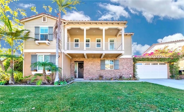 mediterranean / spanish-style home with a front yard, a balcony, and a garage