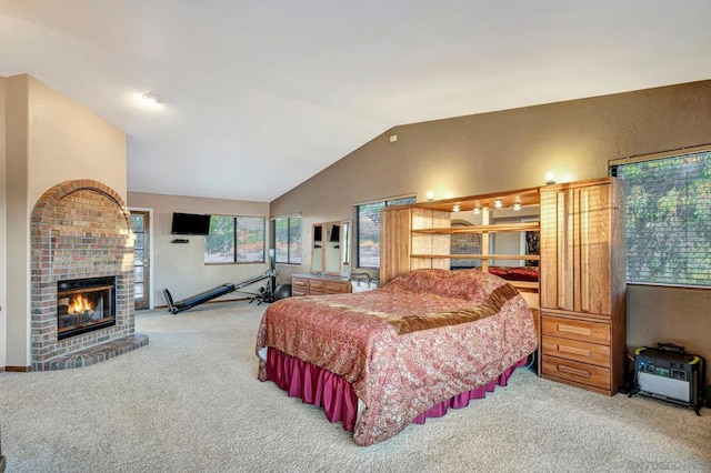 carpeted bedroom with vaulted ceiling and a baseboard heating unit