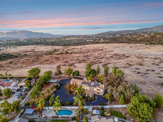 aerial view at dusk with a mountain view