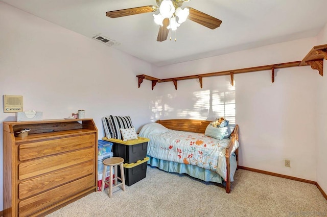 bedroom featuring ceiling fan and carpet