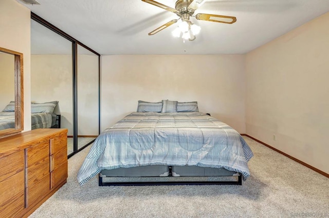 bedroom with ceiling fan and light colored carpet