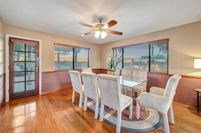 dining room featuring light hardwood / wood-style floors and ceiling fan