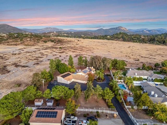 aerial view at dusk with a mountain view