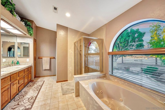 bathroom featuring separate shower and tub, tile patterned flooring, and vanity