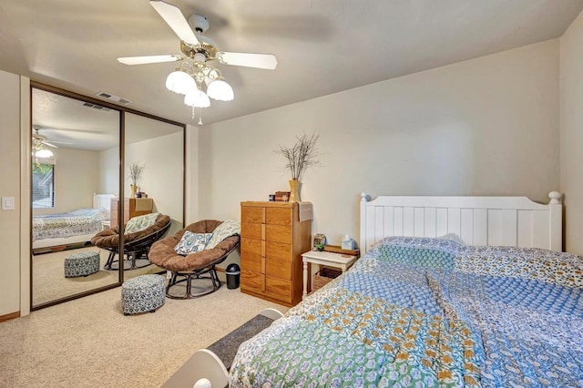 bedroom with carpet flooring, ceiling fan, and a closet