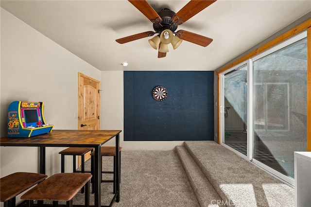 interior space with carpet and ceiling fan