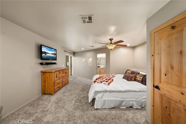 carpeted bedroom featuring ceiling fan and connected bathroom