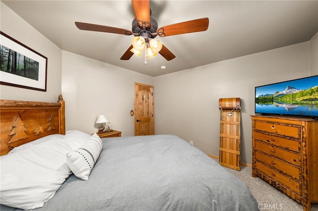 bedroom with light colored carpet and ceiling fan