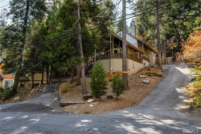 view of side of property featuring a balcony