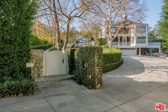 view of gate with a garage