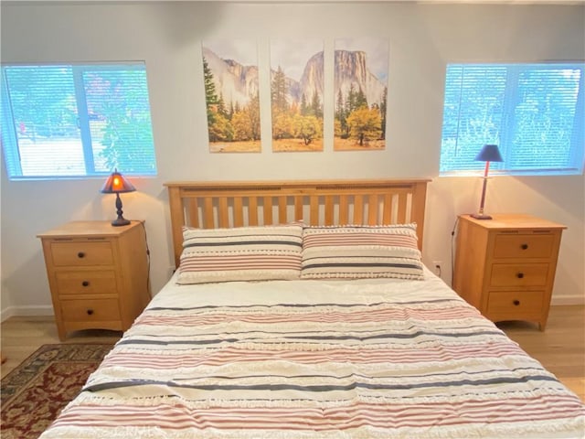 bedroom with hardwood / wood-style floors