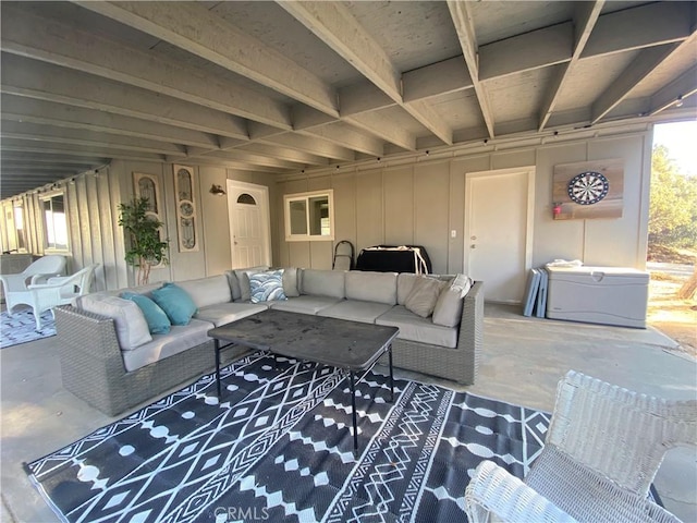 living room featuring concrete flooring