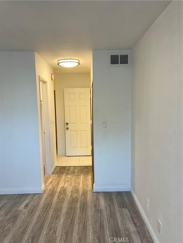 hallway featuring dark wood-type flooring