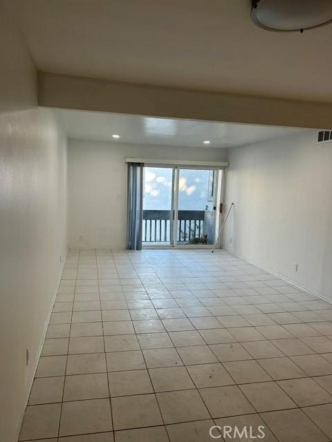 spare room featuring light tile patterned floors