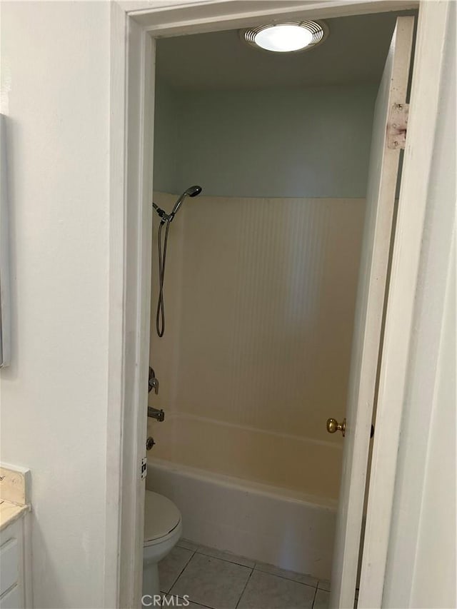 full bathroom featuring tile patterned floors, vanity, toilet, and shower / washtub combination