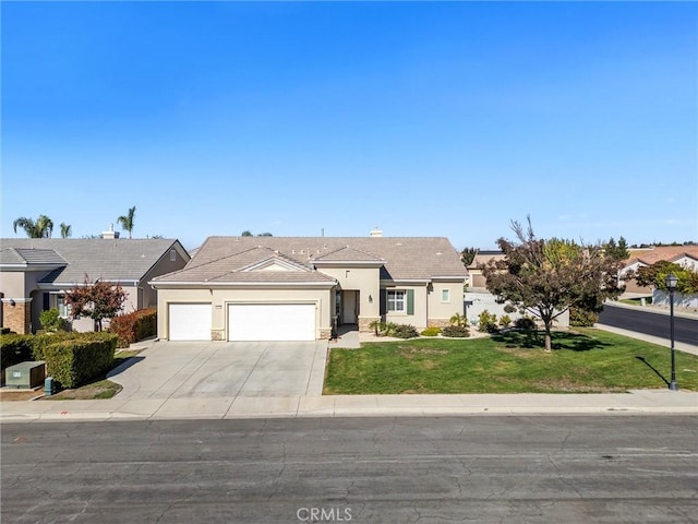 single story home with a front yard and a garage