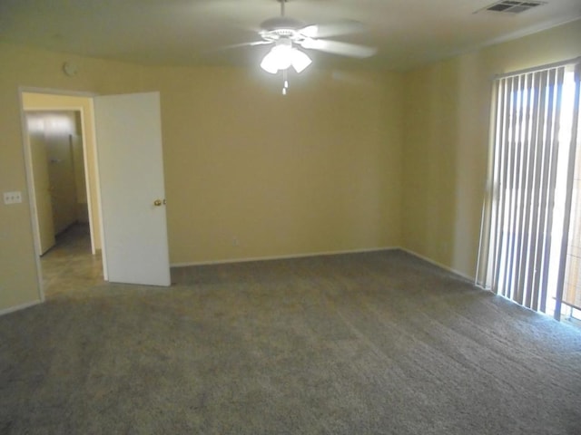 carpeted empty room with ceiling fan