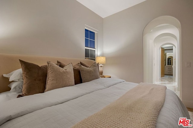 bedroom with vaulted ceiling