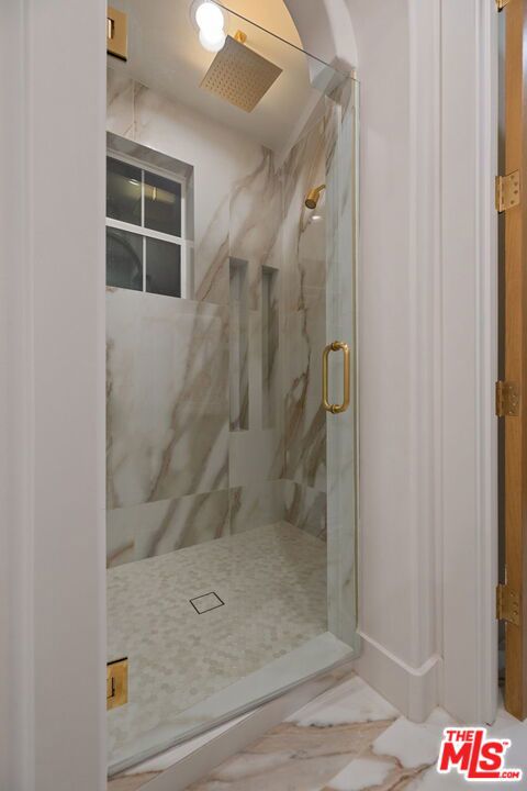 bathroom with an enclosed shower