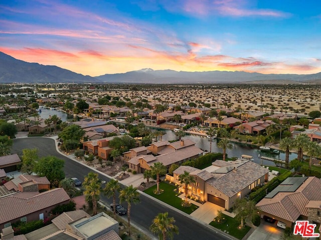 aerial view at dusk with a mountain view