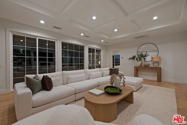 living room featuring light hardwood / wood-style flooring, beamed ceiling, and coffered ceiling