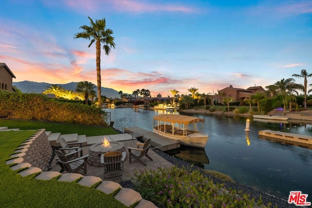 exterior space featuring a water and mountain view