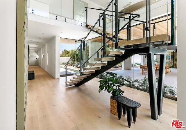 stairs featuring wood-type flooring