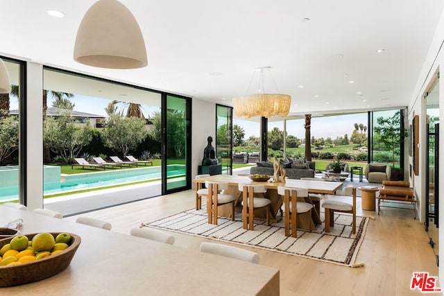 sunroom with an inviting chandelier