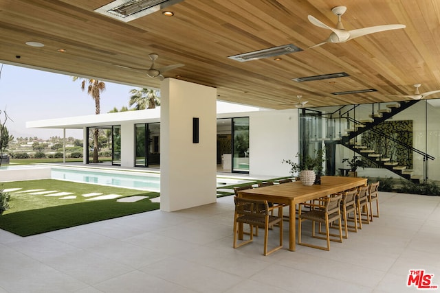 view of patio featuring ceiling fan