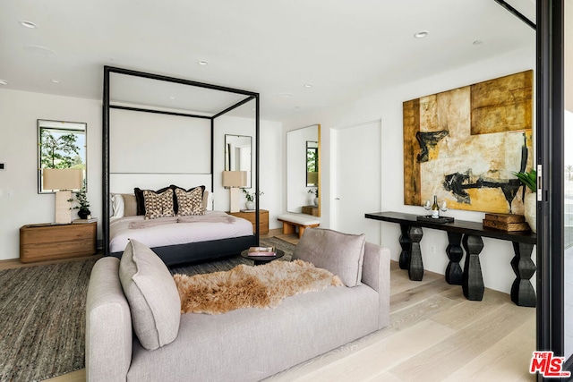 bedroom with light wood-type flooring