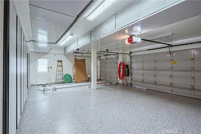 garage featuring a garage door opener