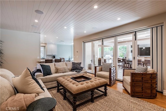 living room with wooden ceiling and light hardwood / wood-style floors