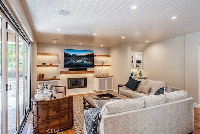 living room with hardwood / wood-style floors and wood ceiling