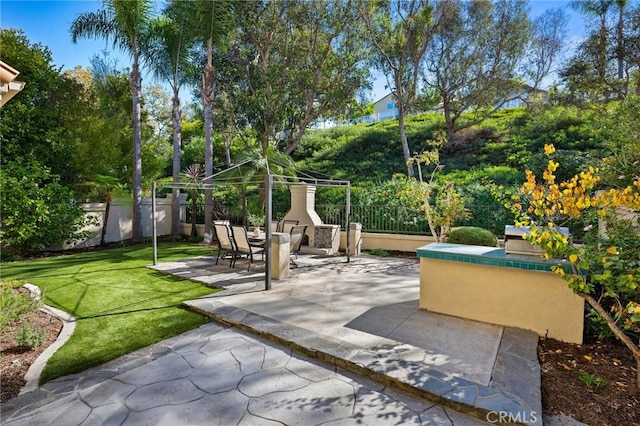 surrounding community with a gazebo, a lawn, and a patio area