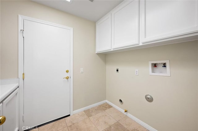 clothes washing area featuring hookup for a gas dryer, cabinets, washer hookup, light tile patterned floors, and electric dryer hookup