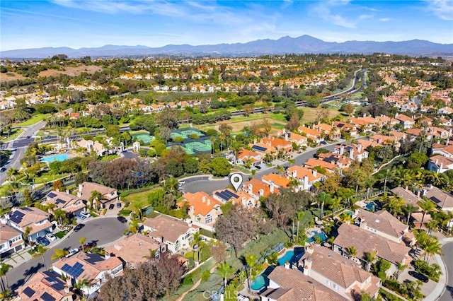 birds eye view of property with a mountain view