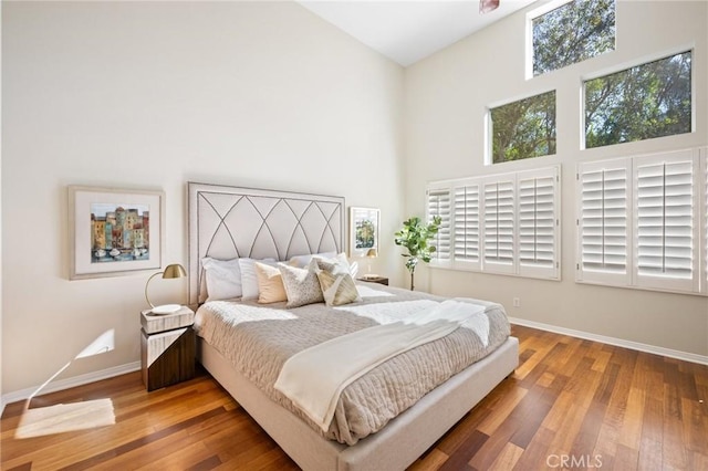 bedroom with hardwood / wood-style flooring