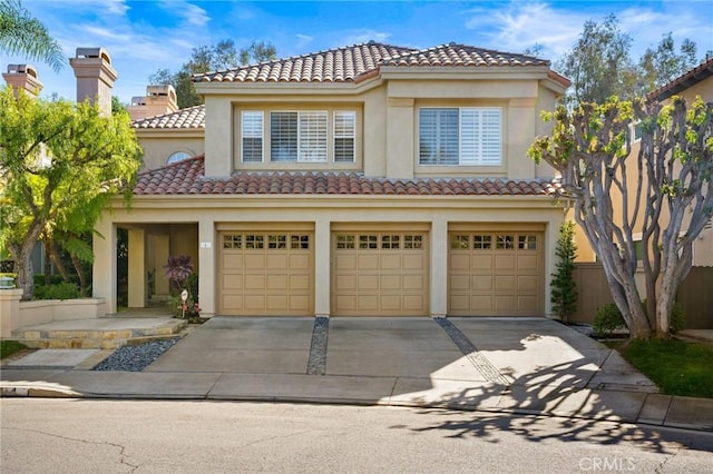 mediterranean / spanish-style house featuring a garage