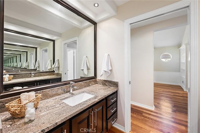 bathroom featuring wood-type flooring and vanity