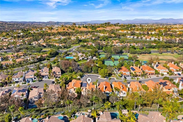 birds eye view of property featuring a mountain view