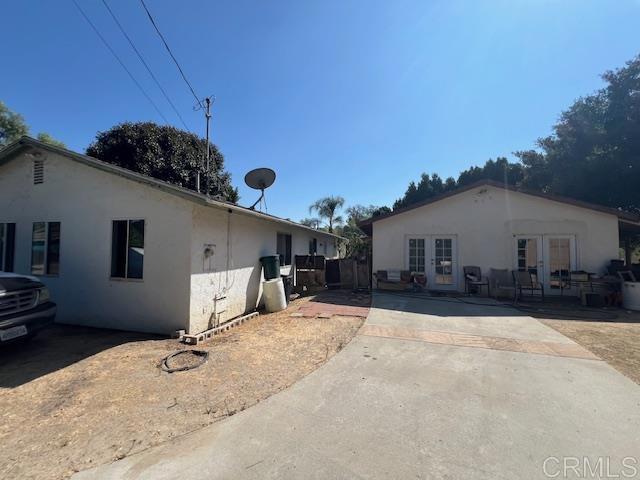 view of home's exterior featuring a patio area and french doors