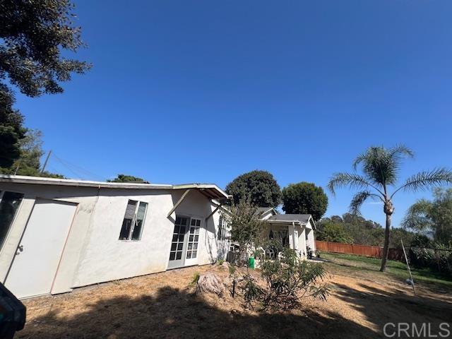 back of property featuring french doors