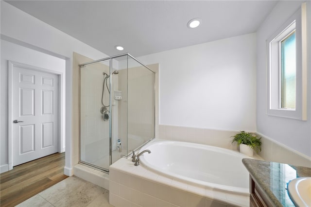 bathroom with vanity, tile patterned floors, and plus walk in shower