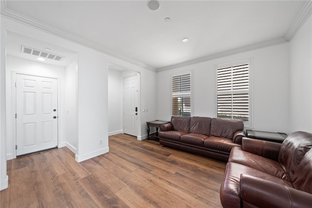 living room with dark hardwood / wood-style flooring and ornamental molding