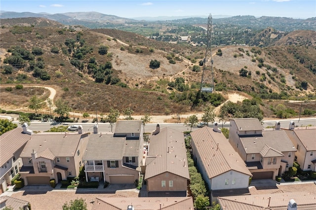 birds eye view of property featuring a mountain view